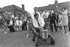 Graham Hill and Damon pushing Jim Clark around on a toy tractor. Different era!